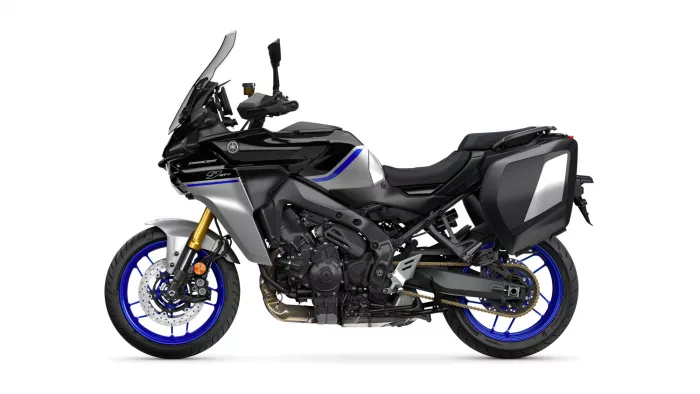 Yamaha Tracer 9 GT sport-touring motorcycle with side panniers and blue rim accents in profile.