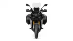 Front view of a black adventure motorcycle with panniers, windscreen, and gold front forks facing forward