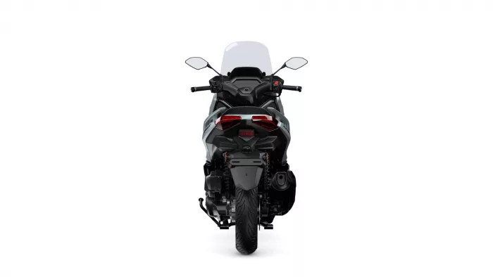 Rear view of a modern sport motorcycle with a tall windshield and red taillights