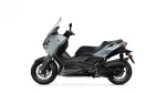 Side view of a gray Yamaha XMAX motor scooter with black accents, showing its windshield and modern styling.