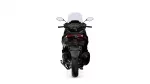 Rear view of a black sport motorcycle with a tall windshield and red taillights on a white background