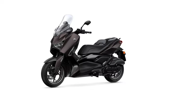Yamaha X-MAX scooter in dark brown/black with a tall clear windshield, shown from a front-left angle.