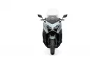 Front view of a gray sport motorcycle with a clear windscreen and angular dual headlights.