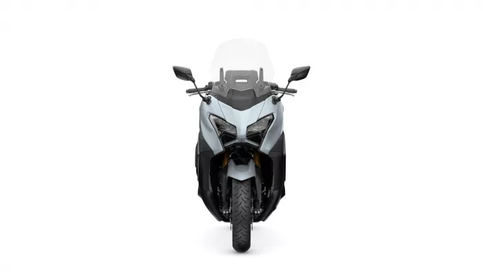 Front view of a gray sport motorcycle with a clear windscreen and angular dual headlights.