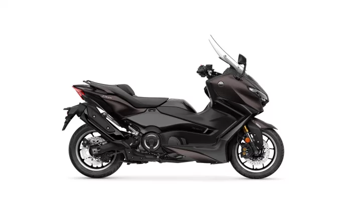 Side view of a dark Yamaha Tmax sport scooter with windshield, shown in profile on a white background