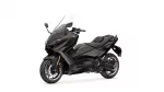 Dark gray sport-tourer motorcycle with a tall windshield, shown from a front-side angle
