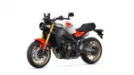Sport motorcycle with white and red bodywork, gold inverted front forks, and black chassis, shown in side view on a white background.