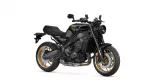 Black Yamaha sport motorcycle with gold wheels, angled left-side view showing engine and exhaust