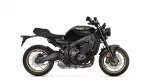 Black Yamaha sports bike shown in a side view with gold alloy wheels (Yamaha logo on the fuel tank).