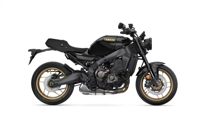 Black Yamaha sports bike shown in a side view with gold alloy wheels (Yamaha logo on the fuel tank).