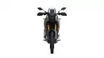 Front view of a black-gray adventure motorcycle facing the camera with gold front forks and a tall windshield on a white background.