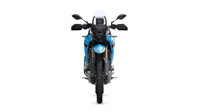 Front view of a blue adventure motorcycle facing forward, with windshield and dual headlights.