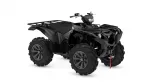 Black four‑wheeled ATV with front and rear cargo racks, large knobby tires, and a red tow strap hanging from the front.