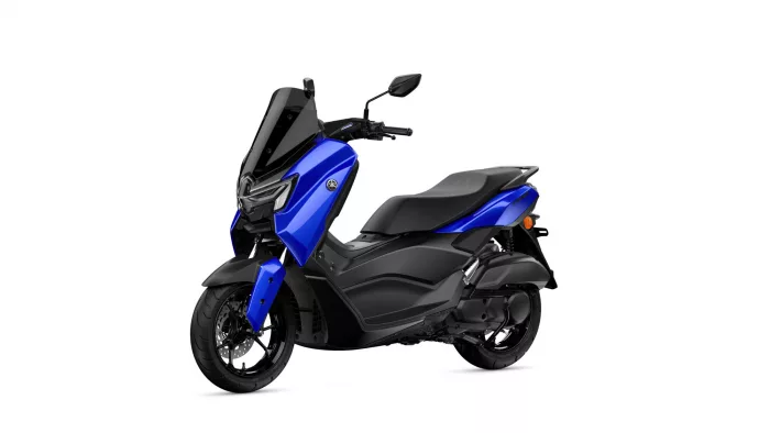 Blue Yamaha scooter photographed from a front-left angle, showing a tall windshield, blue body panels and black seat.