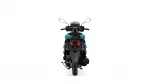 Rear view of a teal and black motorcycle with two mirrors and a red taillight assembly under a white background