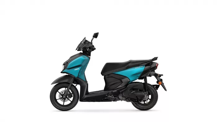 Side view of a teal and black Yamaha scooter photographed from the left.