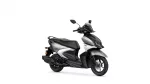 Front-right view of a Yamaha silver-and-black scooter with windshield and dual headlights.