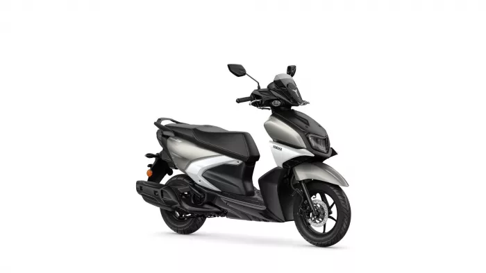 Front-right view of a Yamaha silver-and-black scooter with windshield and dual headlights.