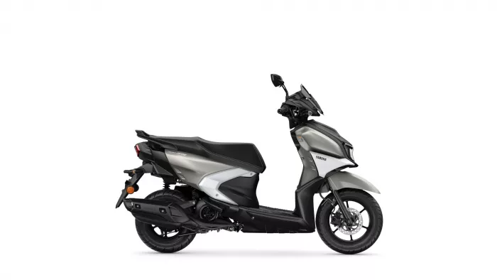 Silver and black Yamaha scooter photographed from the side, showing the seat, body panels, and front wheel with disc brake