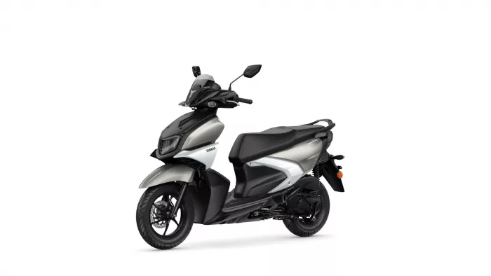 Front-right view of a black and silver Yamaha scooter with a windscreen and headlight.