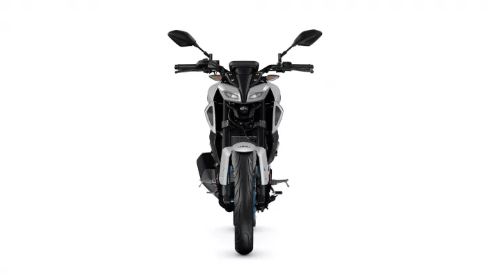 Front-on view of a white and black Yamaha motorcycle centered on a white background, showing its handlebars and dual headlights