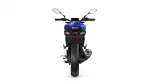 Blue sport motorcycle seen from the rear, showing taillights, exhaust, and rear tire.