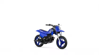 Blue Yamaha dirt bike shown from a front-side angle with knobby tires and a black exhaust, brand name on the side panel