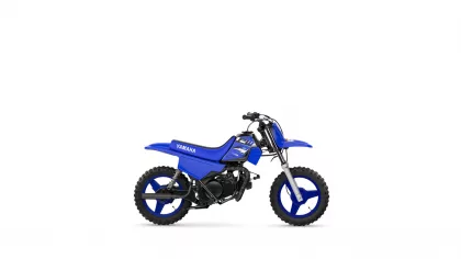 Three-quarter view of a blue Yamaha dirt bike toy on a white background, showing knobby tires and black engine parts.