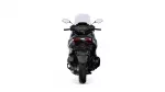 Rear view of a black motorcycle with red tail lights against a white background.