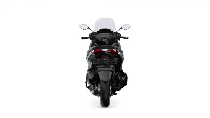 Rear view of a black motorcycle with red tail lights against a white background.