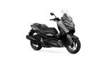 Dark gray Yamaha maxi-scooter with a tall clear windshield and visible front disc brakes.
