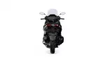 Rear view of a black sport motorcycle showing taillights and single-seat profile against a white background