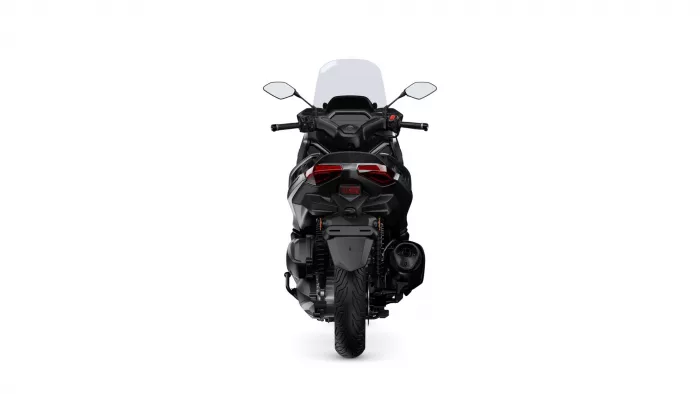 Rear view of a black sport motorcycle showing taillights and single-seat profile against a white background