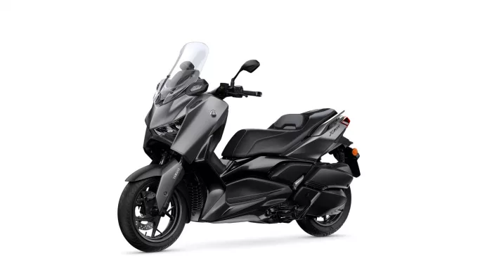 Gray Yamaha XMAX scooter with clear windshield, angled side view on white background.
