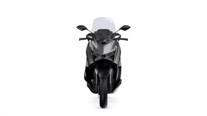 Front view of a black sport motorcycle with a windshield, headlights, and wide handlebars on a white background.