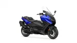 Blue and black sport motorcycle photographed from a side angle, featuring a tall windshield and blue front fairing with Yamaha emblem.