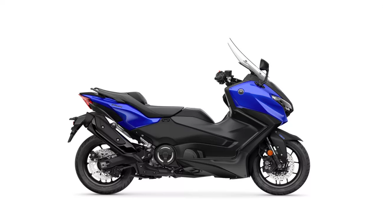 Side view of a blue Yamaha sport motorcycle with black frame and clear windshield on a white background, logo visible on the fairing.