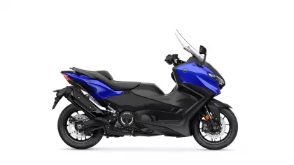Side view of a blue Yamaha sport motorcycle with black frame and clear windshield on a white background, logo visible on the fairing.