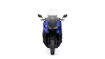 Front view of a blue motorcycle with a tall windshield, showing dual headlights and side mirrors.
