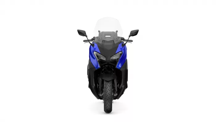 Front view of a blue motorcycle with a tall windshield, showing dual headlights and side mirrors.