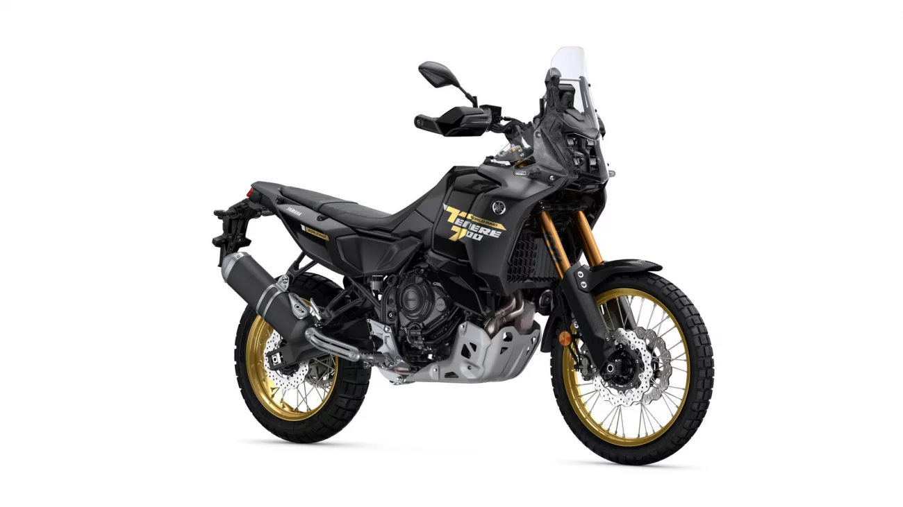 Black Yamaha World Raid adventure motorcycle with gold rims and tall windshield, shown in side view