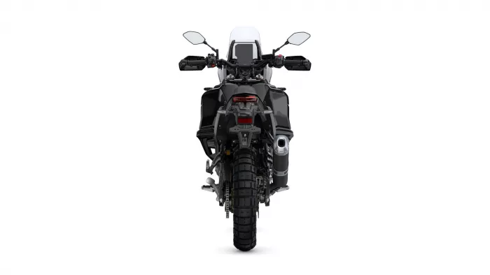 Rear view of a black adventure motorcycle with a tall windscreen, mirrors, taillight, and chunky rear tire.