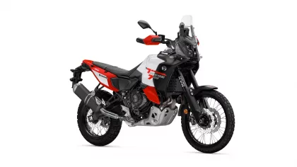 Side view of a red, white, and black Yamaha adventure motorcycle with a tall windscreen and off-road tires on a white background.