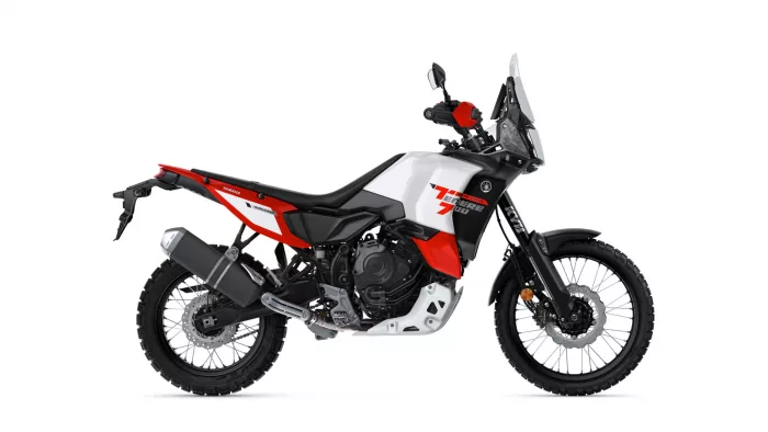 Side view of a white, red, and black Yamaha Tenere 700 World Raid adventure motorcycle.