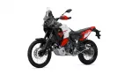 Adventure motorcycle shown from the front-right side with a tall windscreen and knobby tires in white, red, and black livery, resembling a Yamaha Tenere.