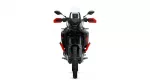 Front view of a black-and-red adventure motorcycle with a tall windshield and rugged tires, facing the viewer from the center.