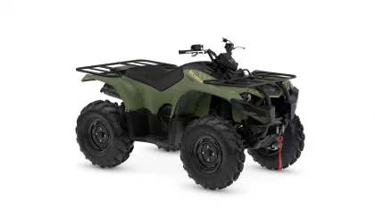 Green Yamaha Kodiak ATV with large knobby tires and front/rear cargo racks【0】.