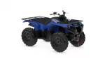 Blue Yamaha ATV with black front and rear racks on a white background in a side-angle view.