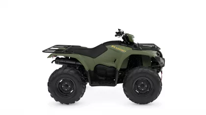 Olive-green Yamaha Kodiak ATV with black seat, cargo racks, and large rugged tires viewed from the side.