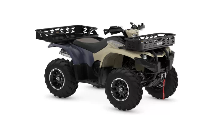 2026-yamaha-yfm450fwbd-s-eu-desert_tan_midnight_blue-360-degrees-001-03 | dandy moto All-terrain vehicle (ATV) with front and rear cargo racks, beige and blue body, large off-road tires, shown from a side angle to highlight storage options.